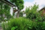 "Sie planen ein Traumhaus mit Garten und es fehlt das passende Grundstück in F-Buchholz?" - Blick auf die rechte Seite des Bungalows